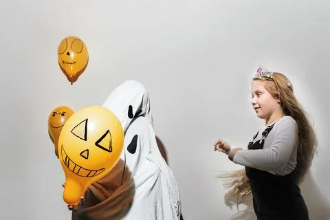 Two house ghosts in front of the child Stock Photos