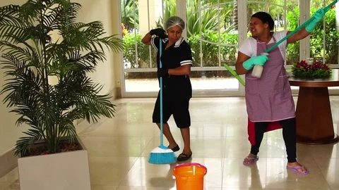 Two Housekeeper Friends Dancing and Having Fun Stock Footage 83455402