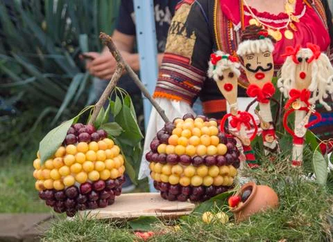 Two huge cherries made of multicolored cherries. Stock Photos