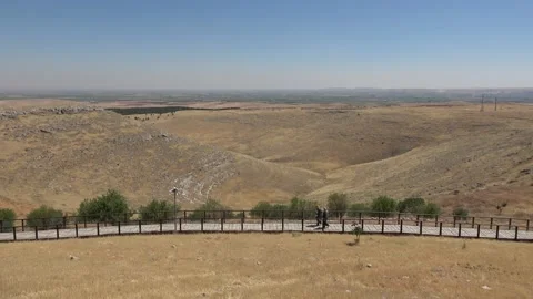 Two human figures walk along the platform to the Gobeklitepe archaeological  Stock Footage 159354639