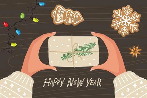 Two human hands holding box wrapped in kraft paper with decoration. Hands with Stock Illustration