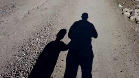 Two human shadows, human figures walking on the road, 스톡 동영상 170091381