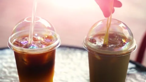 Two iced cold coffee drinks on the table in the cafe. Stock Footage 244637351
