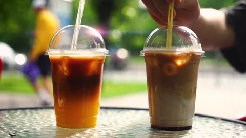 Two iced cold coffee drinks on the table in the cafe. Stock Footage 244637384