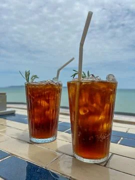 Two Iced Drinks on a Seaside Cafe Table with Tropical Sea View Stock Photos