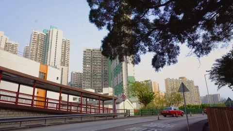 Two Iconic Red Hong Kong Taxis Driving By  Stock Footage 90081812