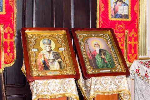 Two icons in beautiful frames stand side by side in the church Stock Photos