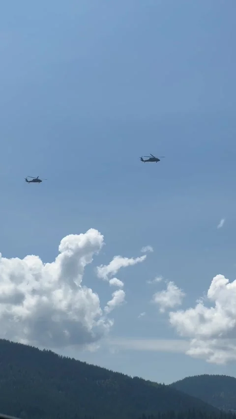 Two identical planes patrol high in the sky Stock Footage 241543626