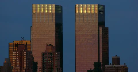 Two identical rectangular skyscrapers against a clear evening sky Stock Footage 67277055
