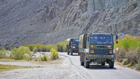 Two Indian army trucks on the road, close to India china border, Ladakh. Stock Footage 121995667