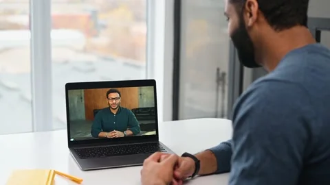 Two indian colleagues speaking through the screen, using laptop app for virtual Stock Footage 166304757