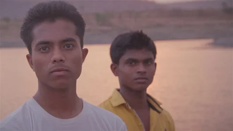 Two Indian confident young men from rural India looking into the lens Stock Footage 82244186