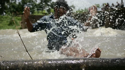Two indian friends having fun in river Stock Footage 59805536