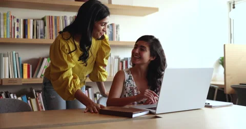 Two Indian workmates working on joint tasks using laptop Stock Footage 260588338