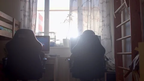 Two individuals collaborate on a project in various cozy settings Stock Footage 311075630