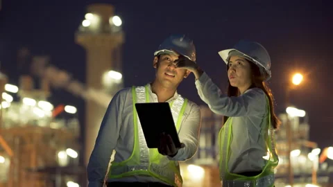 Two industrial engineer using tablet for work and discussing at power plant. Stock Footage 154413536
