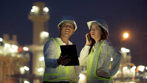 Two industrial engineer using tablet for work and discussing at power plant. Stock Footage 154413782