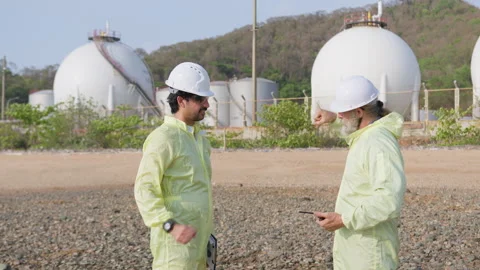 Two industrial engineers shake hands to finalize a successful B2B deal on site Stock Footage 336892133