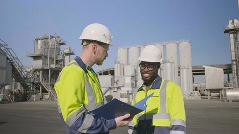 Two industrial inspectors discussing documents Stock Footage 114327139