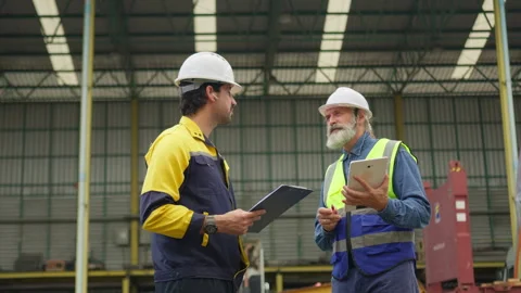 Two industrial workers discuss logistics management Stock Footage 342280563
