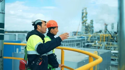 Two industrial workers discussion and pointing for inspection Video stock 76682086