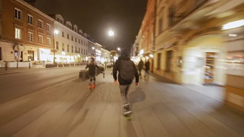 Two inline skaters in the city at night Stockbeeldmateriaal 120750098