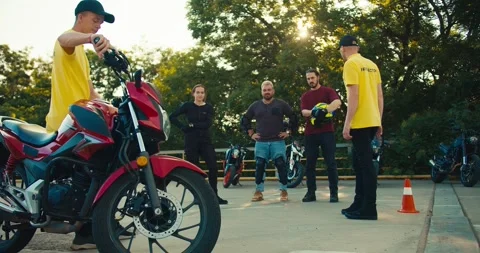 Two instructor guys in a driving school communicate with their students. A group Video stock 249310418