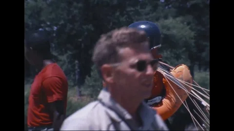 Two instructors attaching strap to Astronaut Neil Armstrong - 1968 Vidéo 104331094