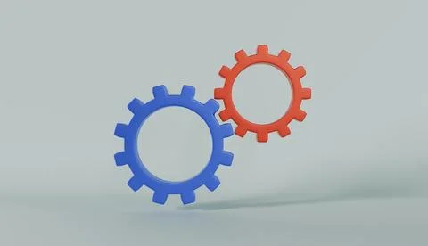 Two interlocking gears in blue and red colors representing teamwork Stock Photos