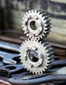 Two interlocking toothed gears Stock Photos