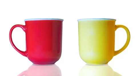 Two isolated large mug cups of red and yellow color Foto stock