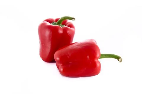 Two isolated red peppers Stock Photos