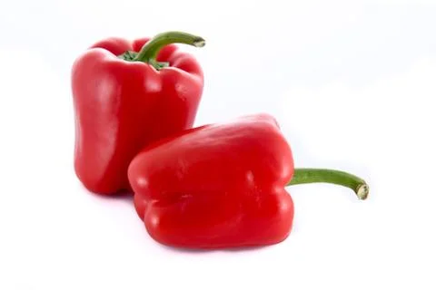 Two isolated red peppers Stock Photos