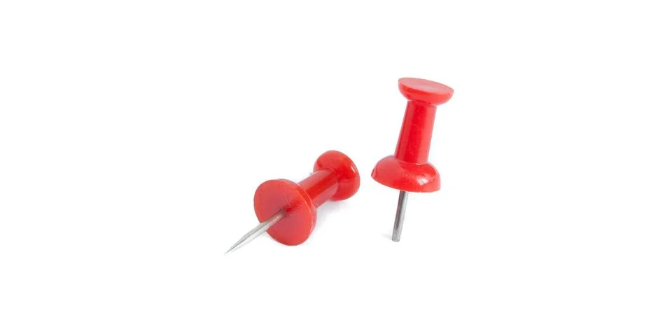 Two isolated red push pins in white background Stock Photos