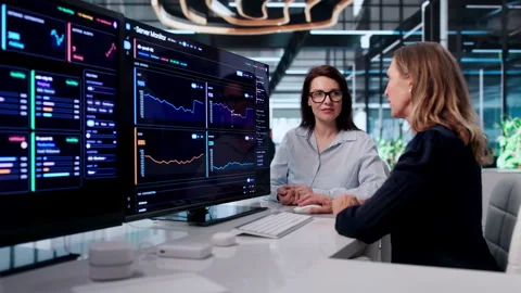Two IT Experts Track Network Performance On Computers Stock Footage 342986738