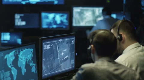 Two IT professionals are spying on businessman through satellite surveillance Stock Footage 59375596