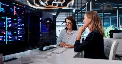 Two IT Professionals Tracking Network Data And Managing Servers Efficiently. Stock Photos