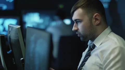 Two IT programmers are working on computers in a dark office room 스톡 동영상 59157097