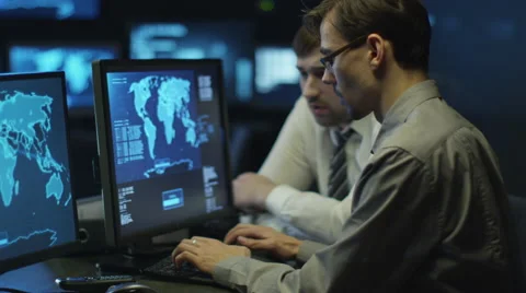 Two IT programmers are working on computer in a dark office room 스톡 동영상 59385914