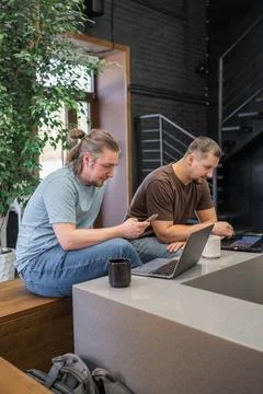 Two It Software engineers working on project and programming in coffee shop Stock-Fotos