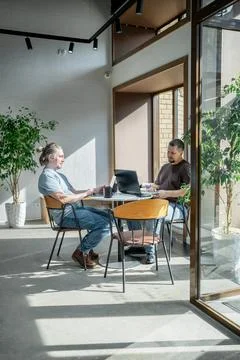 Two It Software engineers working on project and programming in coffee shop Stock-Fotos