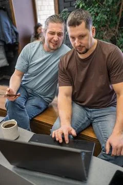 Two It Software engineers working on project and programming in coffee shop Stock-Fotos