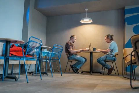 Two It Software engineers working on project and programming in coffee shop Stock-Fotos