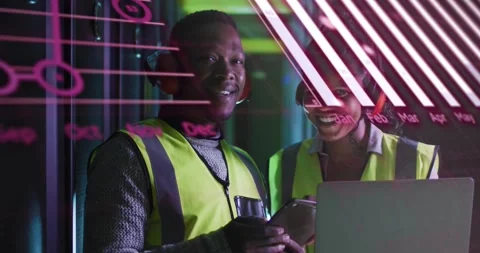 Two IT techs tapping phone and reviewing laptop data in data center, animated Stock Footage 334185160