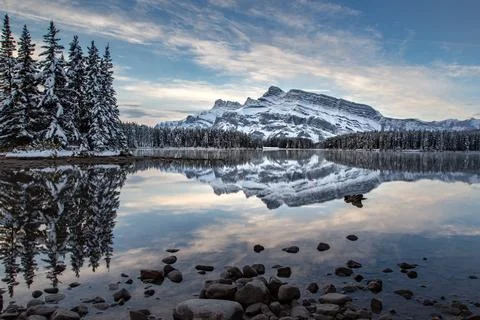 Two jack lake and mt rundle during late fall in Banff national park in late fall Stock Photos