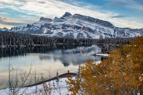 Two jack lake and mt rundle during late fall in Banff national park in late fall Stock Photos