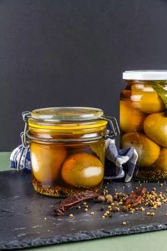 Two jars of pickled eggs, copyspace. Stock Photos