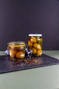 Two jars of pickled eggs, copyspace at top. Stock Photos