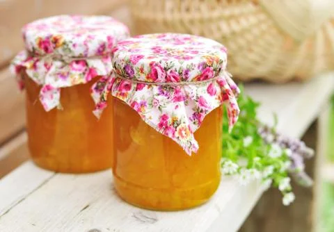 Two Jars of Pumpkin Jam on a Bench, copy space for your text Stock Photos