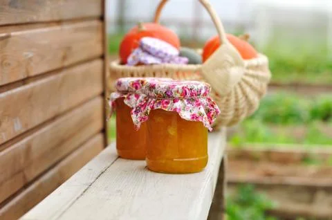 Two Jars of Pumpkin Jam on a Bench, copy space for your text Stock Photos